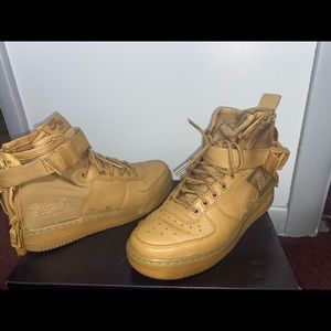 Khaki colored high top nike Air Force 1s